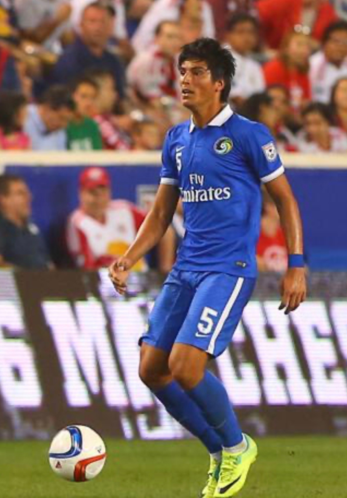 Samuel Caceres playing in a blue New York Cosmos number 5 kit